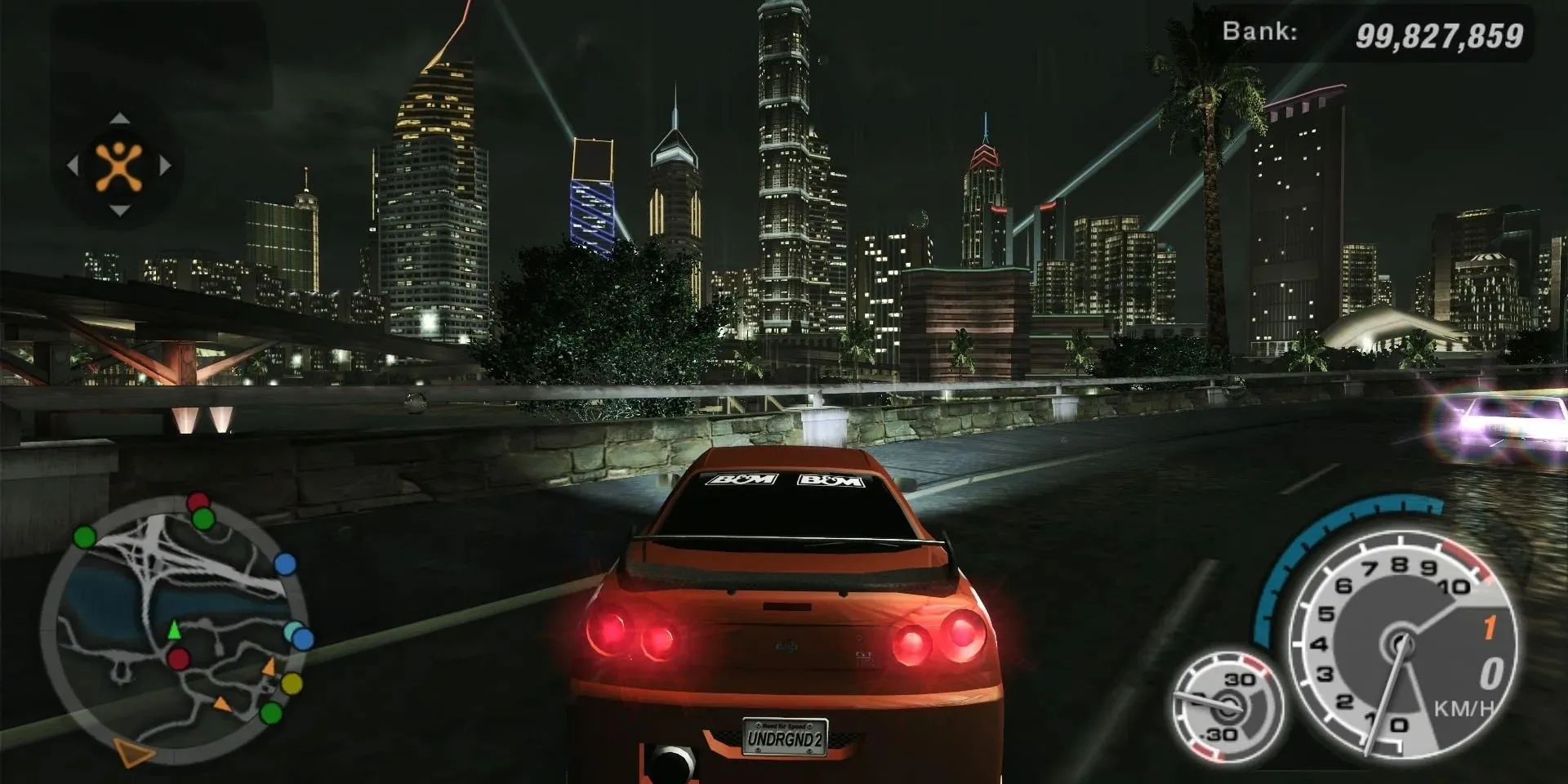 Chiếc Nissan Skyline độ đèn neon lướt trên đường phố đêm trong Need For Speed Underground 2