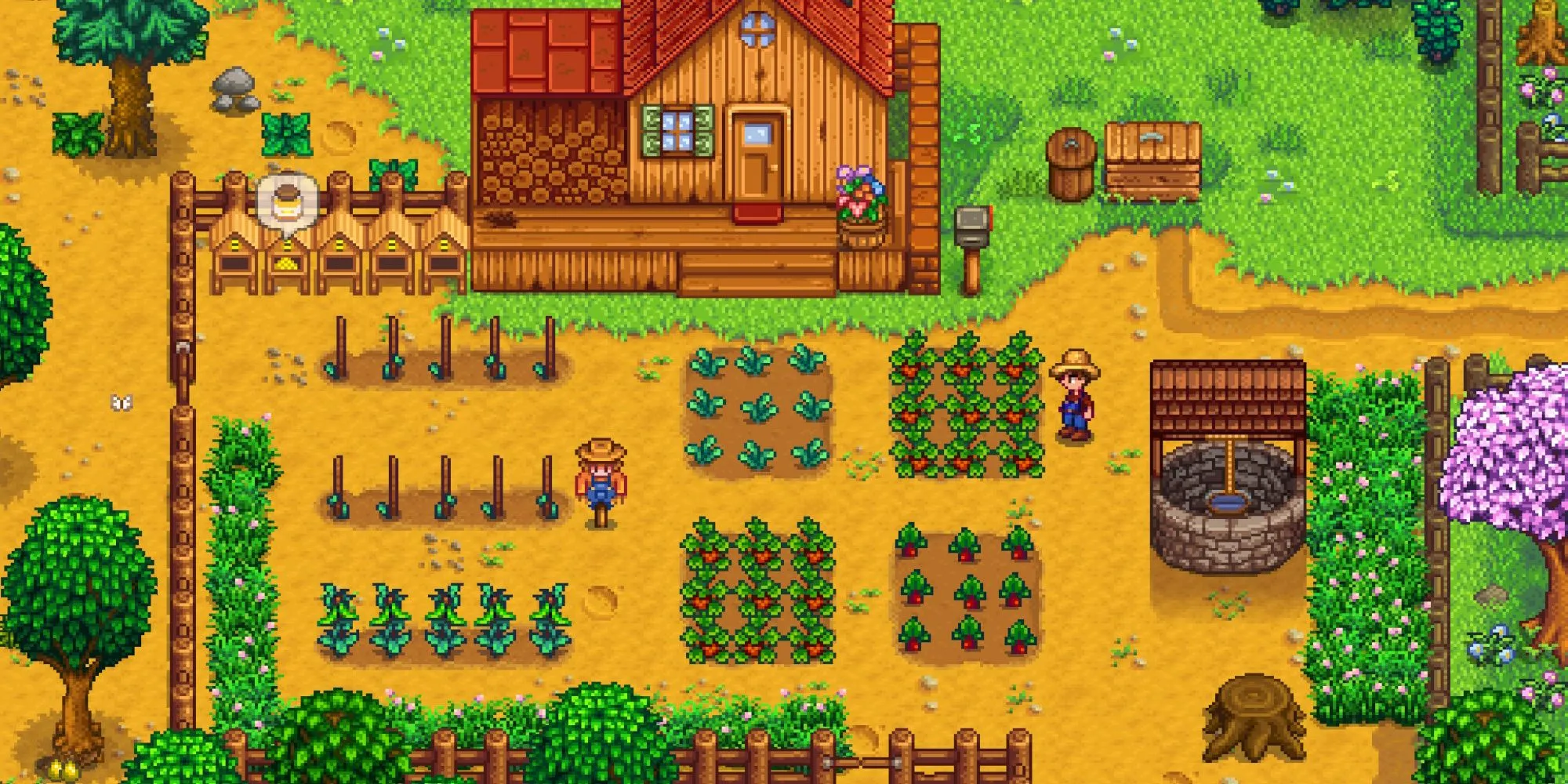 Toàn cảnh trang trại của người chơi với cây trồng và giếng nước trong Stardew Valley.