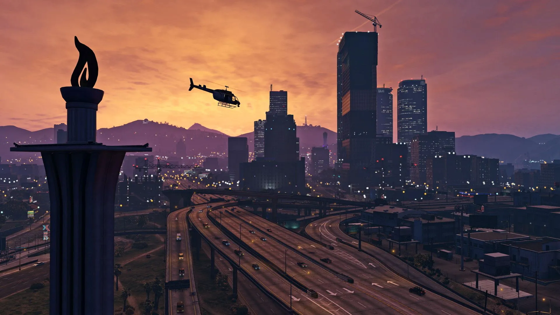 Cảnh thành phố Los Santos về đêm với ánh đèn rực rỡ, đường xá đông đúc trong Grand Theft Auto 5