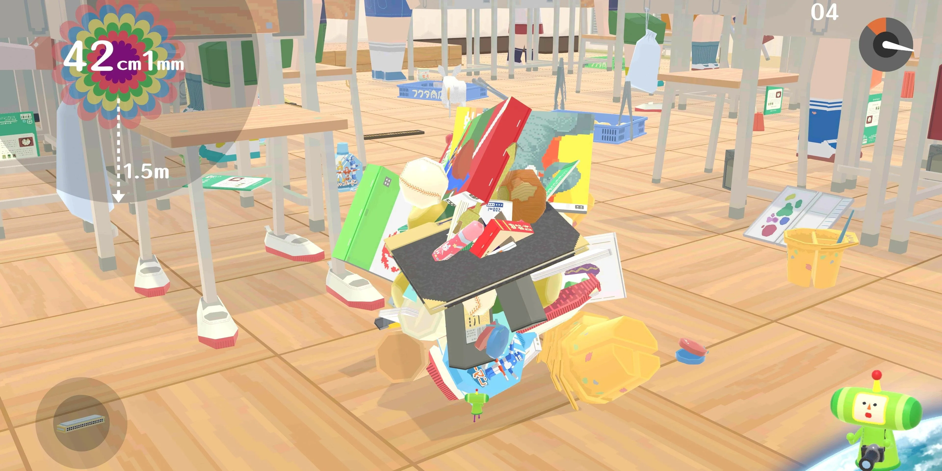 Đẩy quả cầu Katamari trong một lớp học trong We Love Katamari Reroll