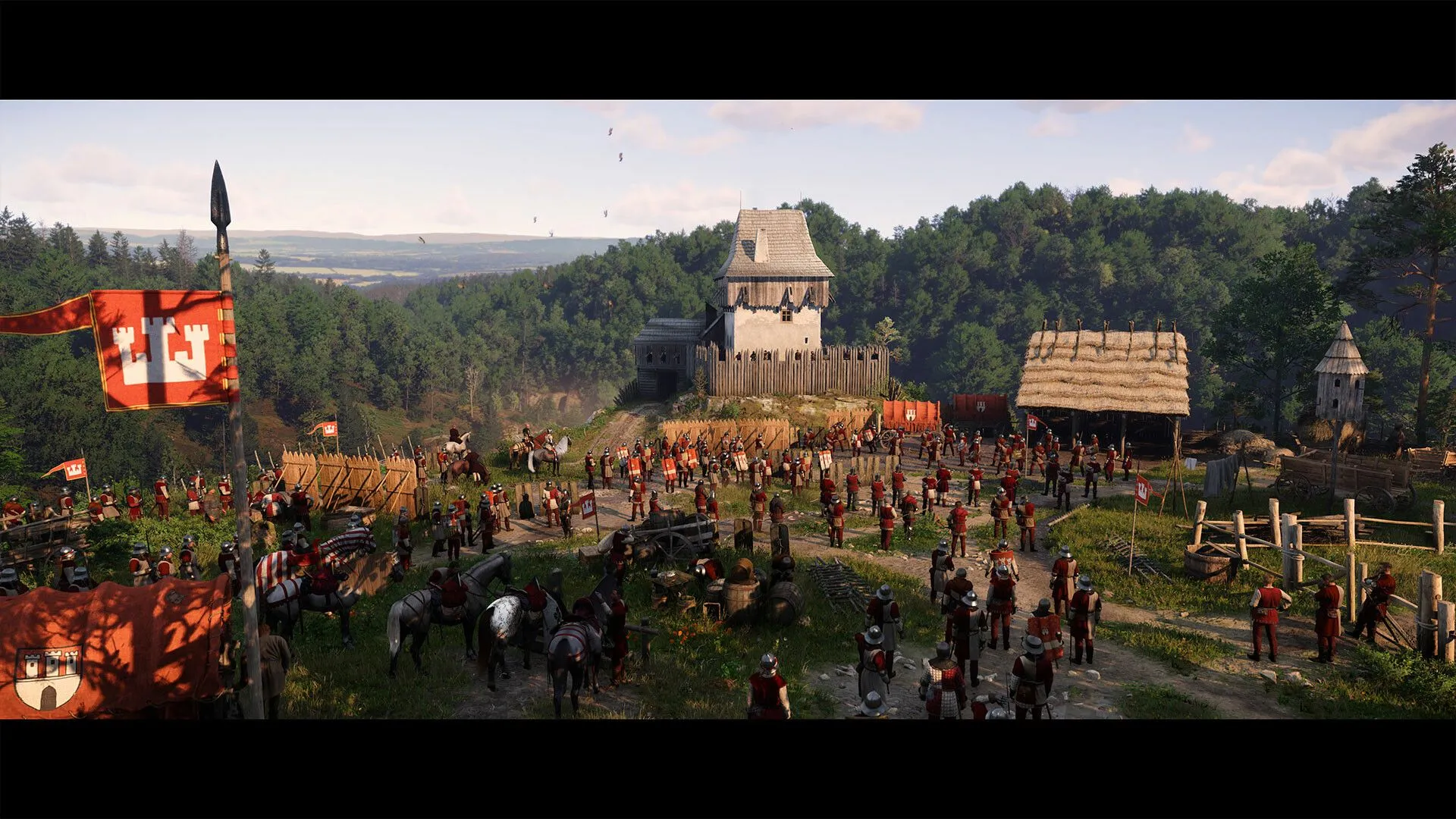 Henry trong Kingdom Come Deliverance 2 đang đứng trước một khung cảnh lớn, có thể là một lâu đài hoặc thành trì, thể hiện quy mô của thế giới game.