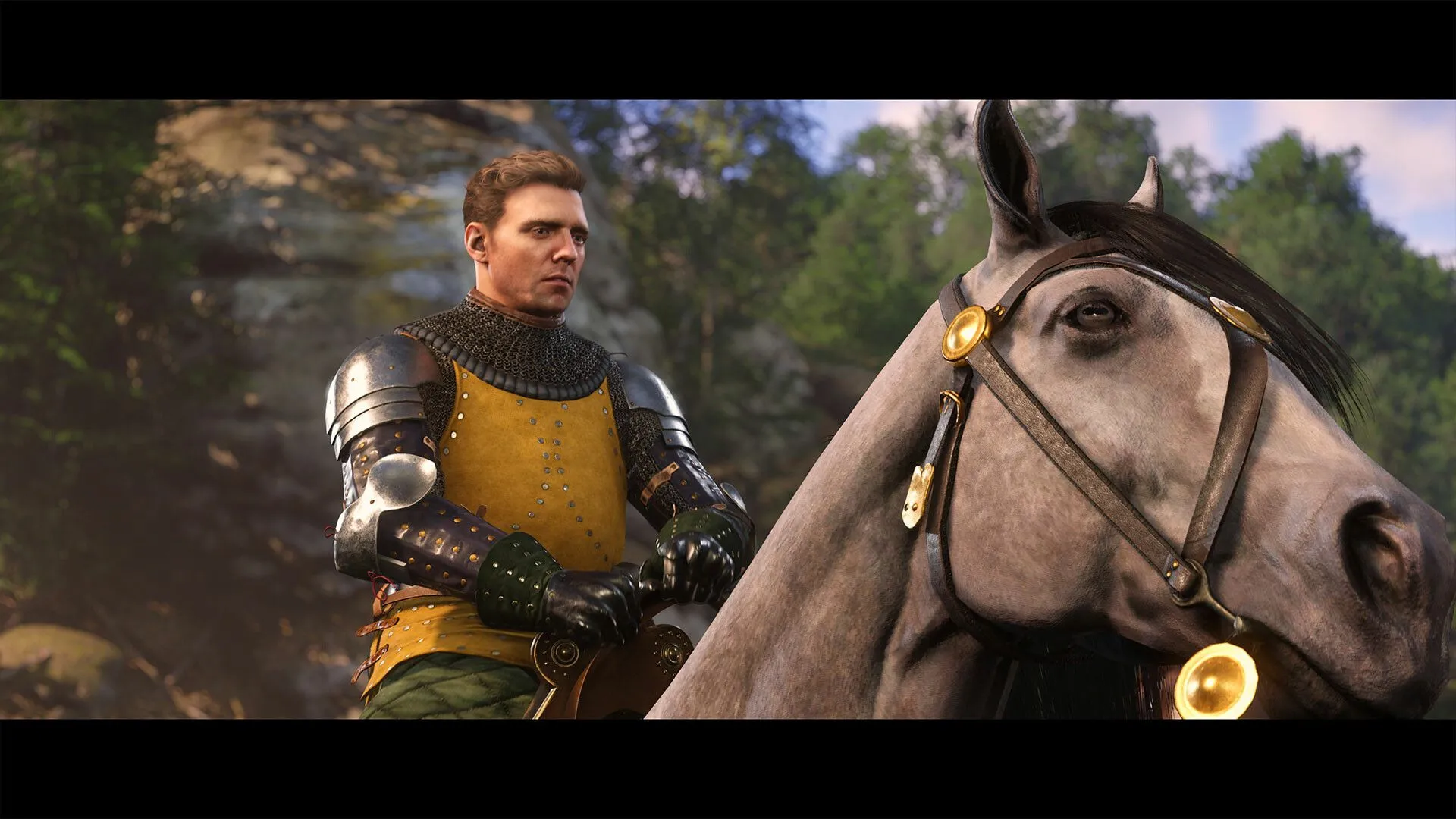 Henry với áo giáp nặng trong Kingdom Come Deliverance 2, sẵn sàng cho trận chiến hoặc nhiệm vụ khó khăn, toát lên vẻ kiên cường và dũng mãnh.