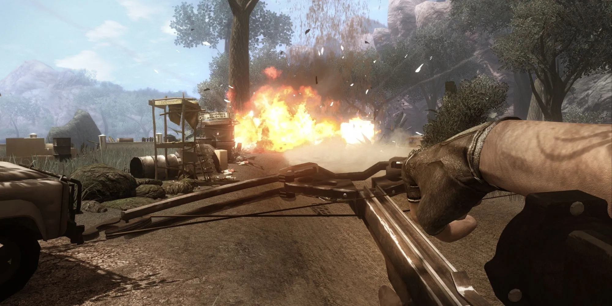 Một cảnh quan trong game Far Cry 2 với hiệu ứng khói và cây cối